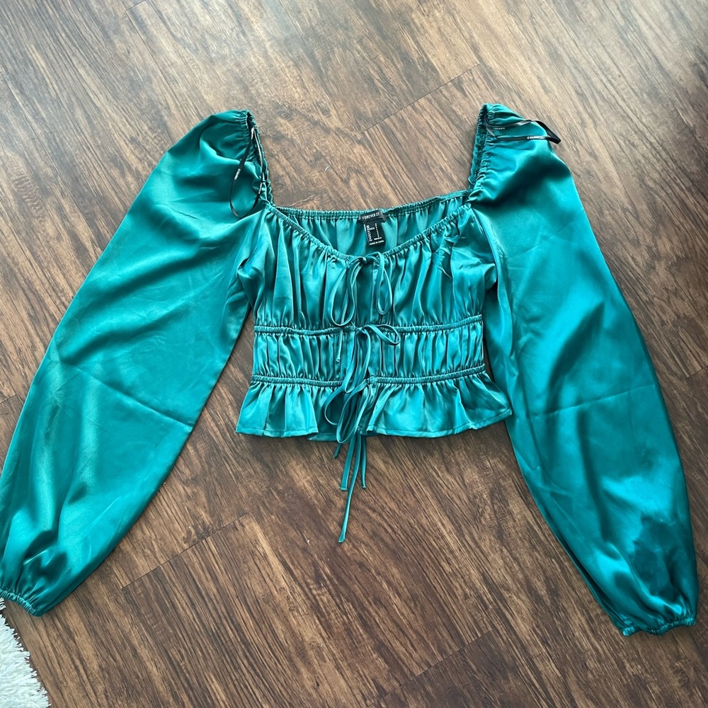 Emerald green long sleeve going out top.